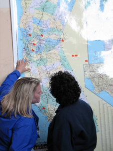 2 people looking at a map of California